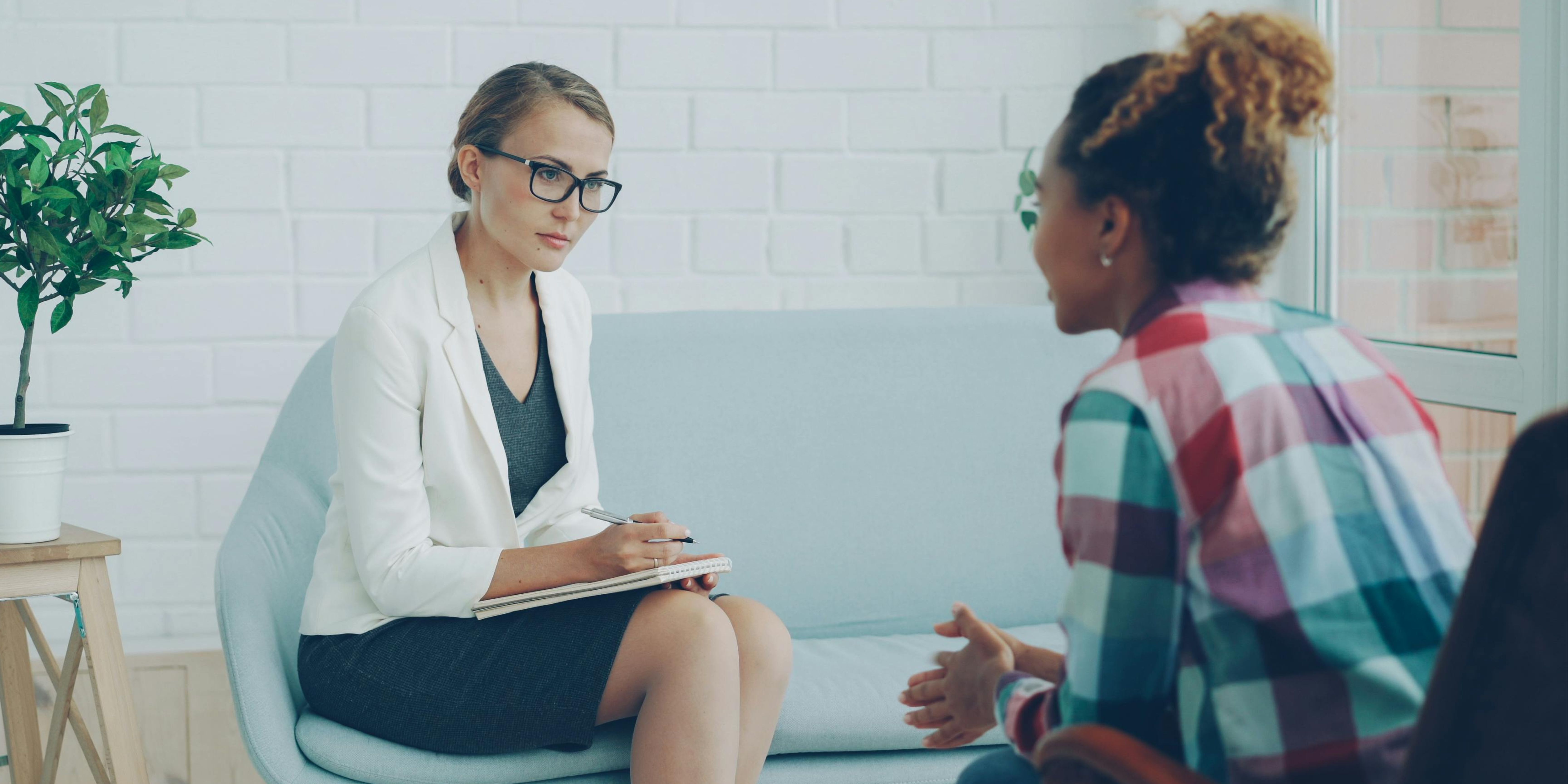 A doctor speaking with a patient.